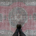 1970s pink vintage turkish rug with medallion design, hand-knotted weave and low pile.