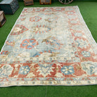 Pale Blue 7' x 12' vintage turkish rug in wool and cotton, shown on the floor.