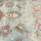1970s pale blue vintage turkish rug with floral design, hand-knotted weave and low pile.