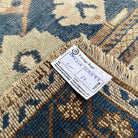 Close-up of the blue vintage turkish rug showing traditional details, hand-knotted weave, wool and cotton and low pile.