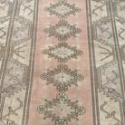 1970s beige vintage turkish rug with neutral design, hand-knotted weave and low pile.