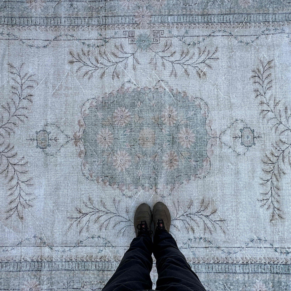 1970s green vintage turkish rug with medallion design, hand-knotted weave and low pile.