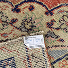 1970s pale red vintage turkish rug with medallion design, hand-knotted weave and low pile.