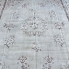 1970s beige vintage turkish rug with neutral and medallion design, hand-knotted weave and low pile.