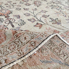 1970s pink vintage turkish rug with floral and neutral design, hand-knotted weave and low pile.