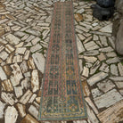 Pink 2' x 10' vintage turkish runner rug in wool and cotton, shown on the floor.