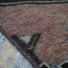 Pale Red 2' x 11' vintage turkish runner rug in wool and cotton, shown on the floor.