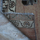 1970s pale red vintage turkish runner rug with traditional design, hand-knotted weave and low pile.