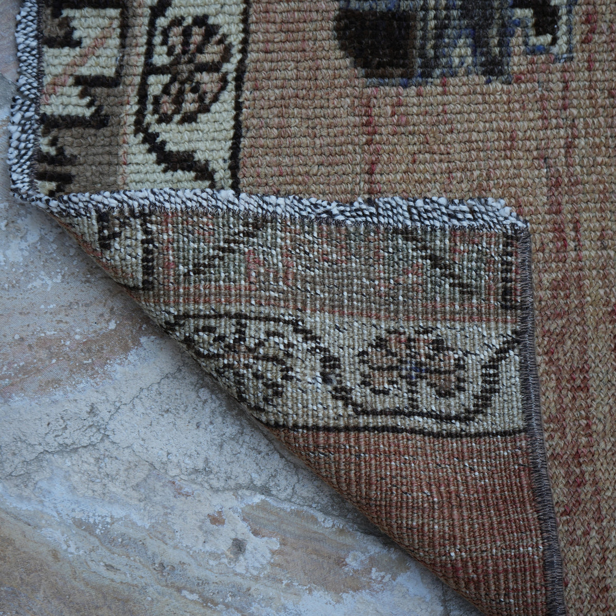 1970s pale red vintage turkish runner rug with traditional design, hand-knotted weave and low pile.