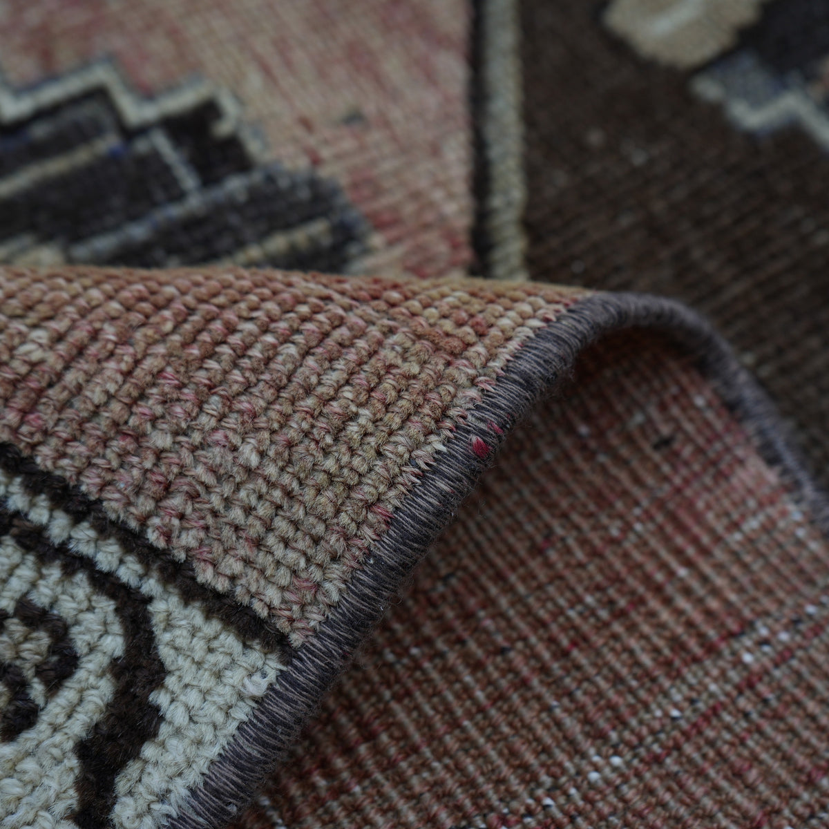 Additional view of the pale red vintage turkish runner rug, hand-knotted in wool and cotton.