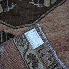 Pale Red 2' x 11' vintage turkish runner rug from the 1970s with traditional design.