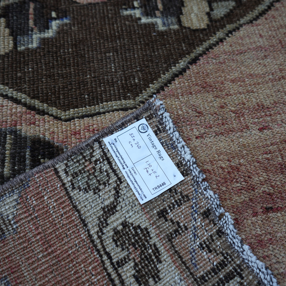 Pale Red 2' x 11' vintage turkish runner rug from the 1970s with traditional design.