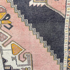 1970s pink vintage turkish runner rug with traditional design, hand-knotted weave and low pile.