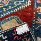 Close-up of the blue vintage turkish runner rug showing oushak details, hand-knotted weave, wool and cotton and low pile.