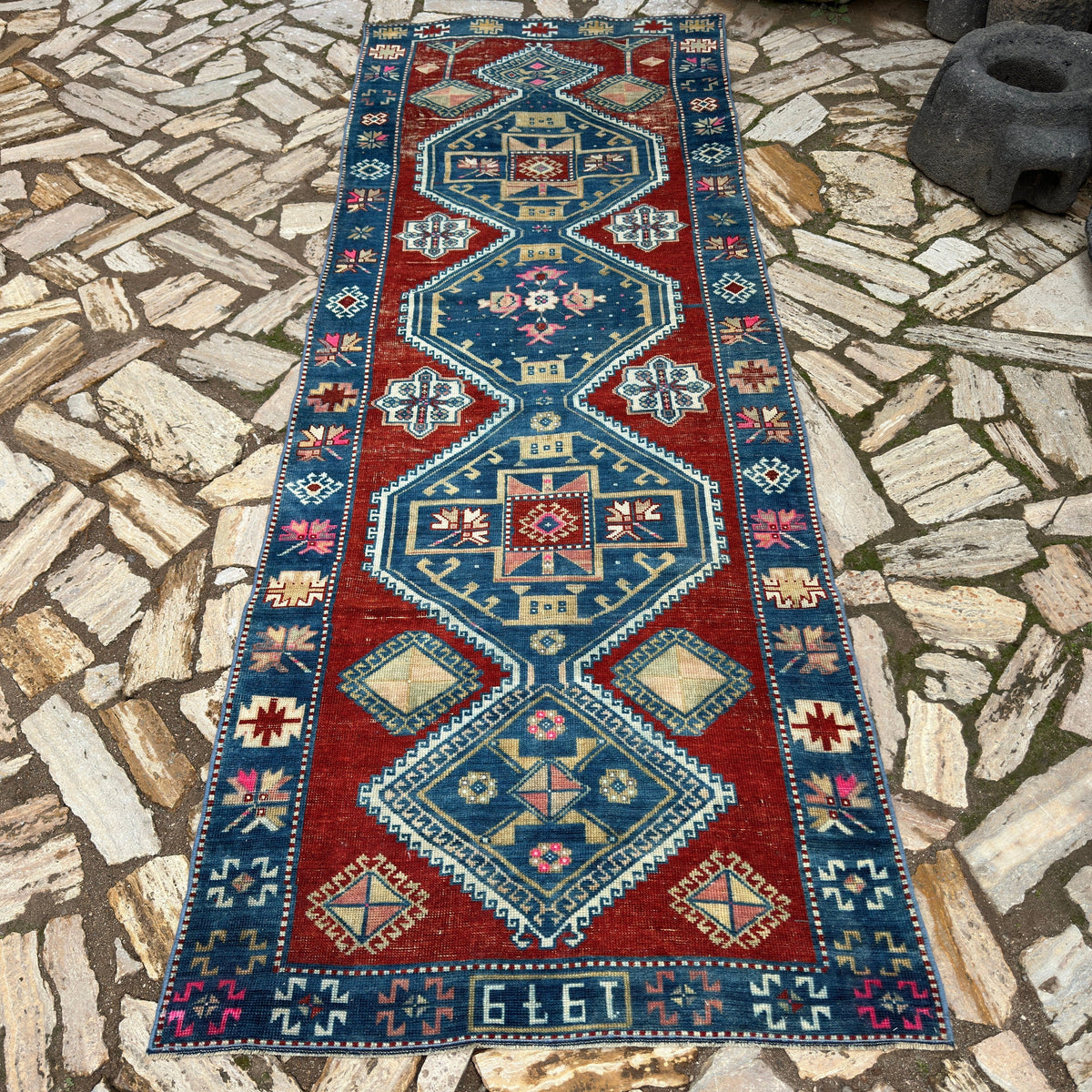 Blue 3' x 10' vintage turkish runner rug in wool and cotton, shown on the floor.