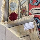 Close-up of the gray vintage turkish runner rug showing oushak details, hand-knotted weave, wool and cotton and low pile.