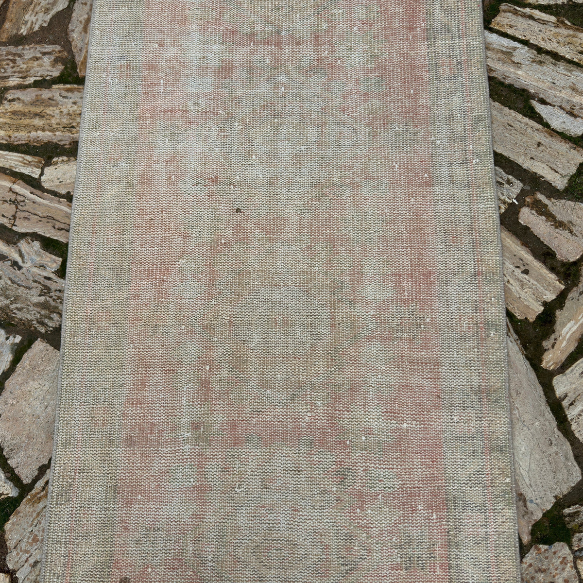 1970s pale pink vintage turkish runner rug with traditional design, hand-knotted weave and low pile.