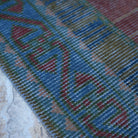 Blue 3' x 11' vintage turkish runner rug in wool and cotton, shown on the floor.