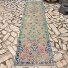 Pale Green 3' x 11' vintage turkish runner rug in wool and cotton, shown on the floor.