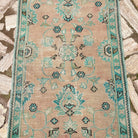 1970s pale green vintage turkish runner rug with floral design, hand-knotted weave and low pile.
