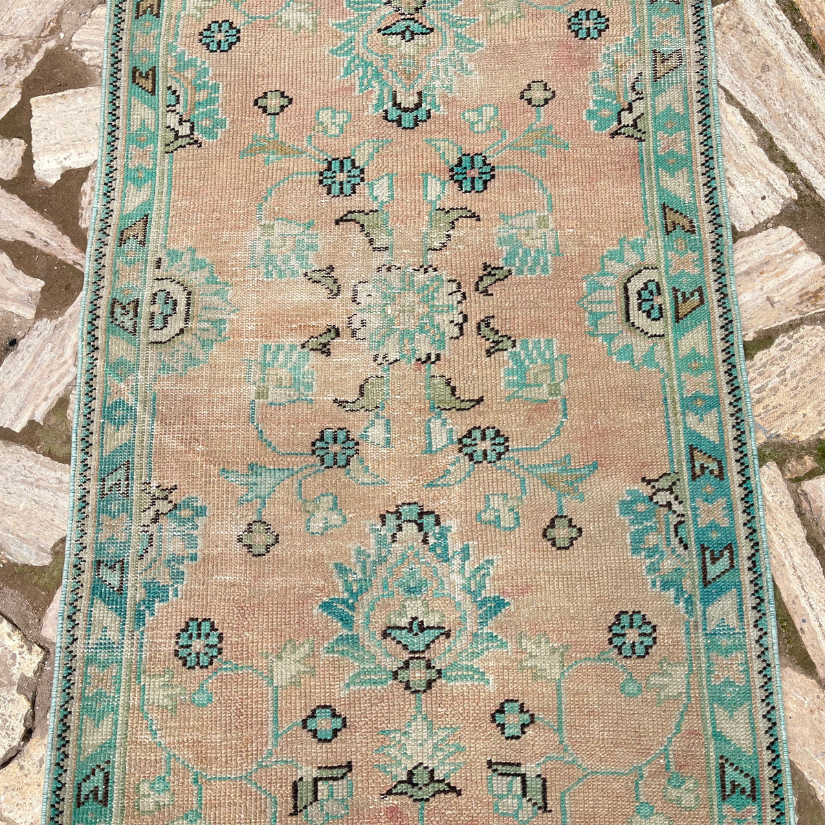 1970s pale green vintage turkish runner rug with floral design, hand-knotted weave and low pile.