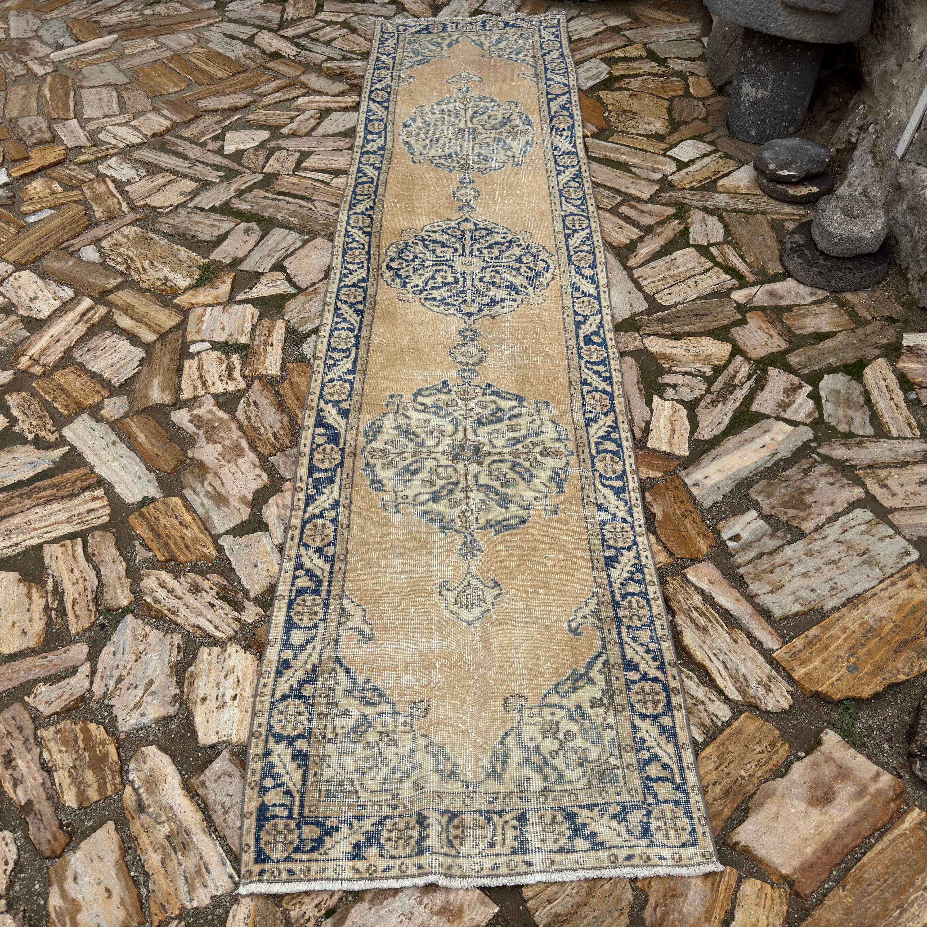 Pale Yellow 3' x 11' vintage turkish runner rug in wool and cotton, shown on the floor.