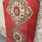 1970s red vintage turkish runner rug with traditional design, hand-knotted weave and low pile.