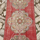1970s red vintage turkish runner rug with geometric design, hand-knotted weave and low pile.