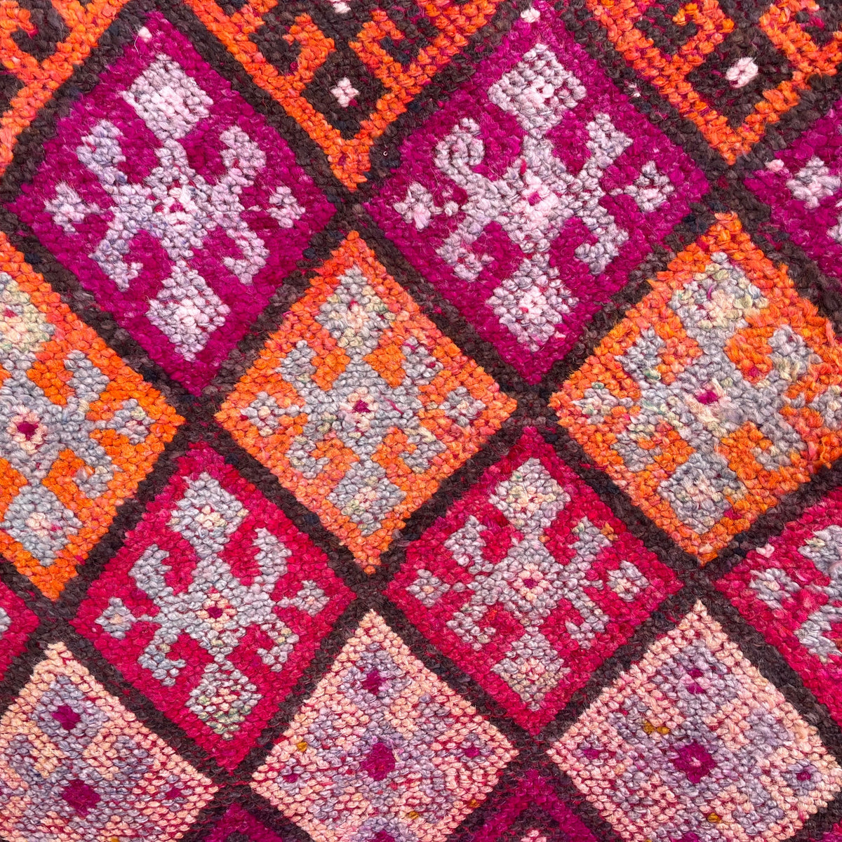 Pink 3' x 12' vintage turkish runner rug in wool and cotton, shown on the floor.