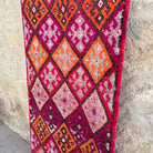 1970s pink vintage turkish runner rug with traditional design, hand-knotted weave and medium pile.