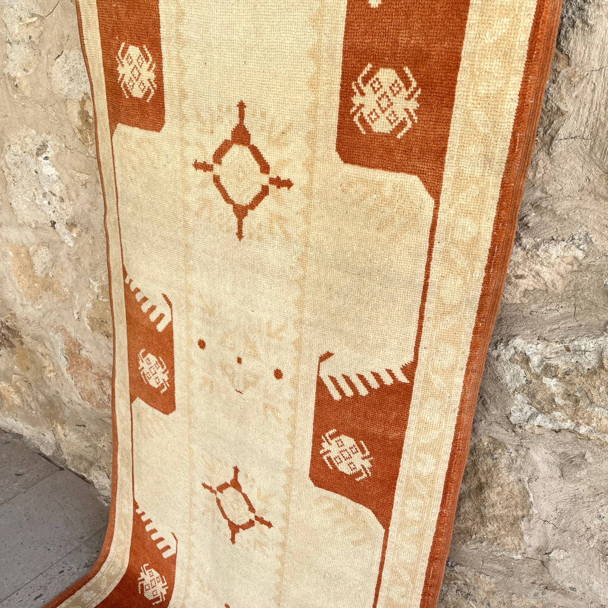 1970s beige vintage turkish runner rug with traditional design, hand-knotted weave and low pile.