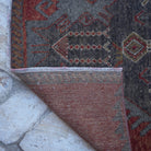 1970s red vintage turkish runner rug with traditional design, hand-knotted weave and low pile.