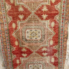 1970s red vintage turkish runner rug with traditional design, hand-knotted weave and low pile.