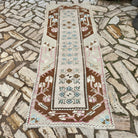 Pale Pink 3' x 8' vintage turkish runner rug in wool and cotton, shown on the floor.