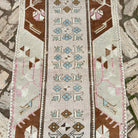 1970s pale pink vintage turkish runner rug with traditional design, hand-knotted weave and low pile.