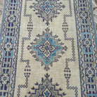 1970s blue vintage turkish runner rug with traditional design, hand-knotted weave and low pile.