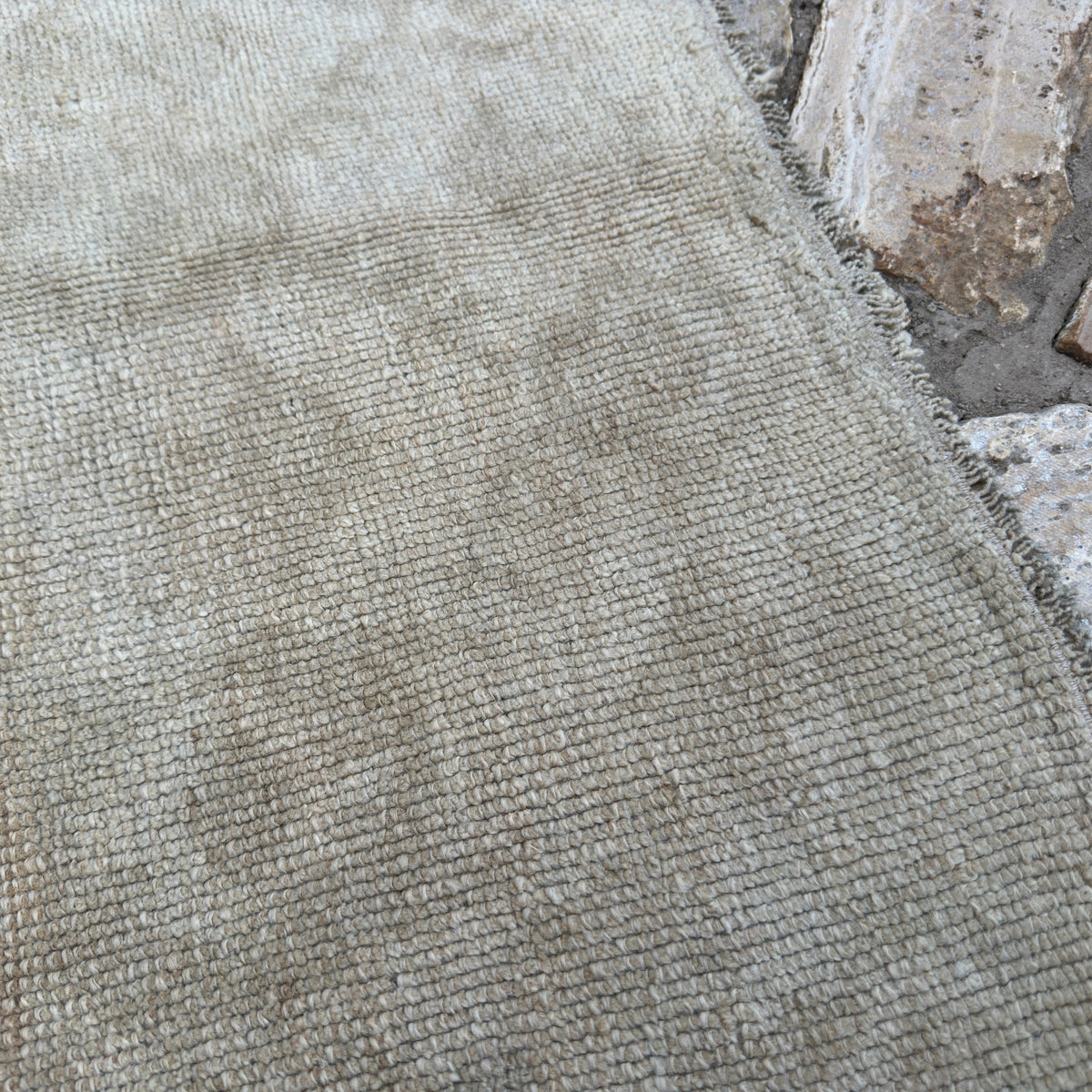 Close-up of the brown vintage turkish runner rug showing neutral details, hand-knotted weave, wool and cotton and low pile.