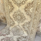 Brown 5' x 13' vintage turkish runner rug in wool and cotton, shown on the floor.