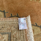 Close-up of the orange vintage turkish runner rug showing traditional details, hand-knotted weave, wool and cotton and low pile.