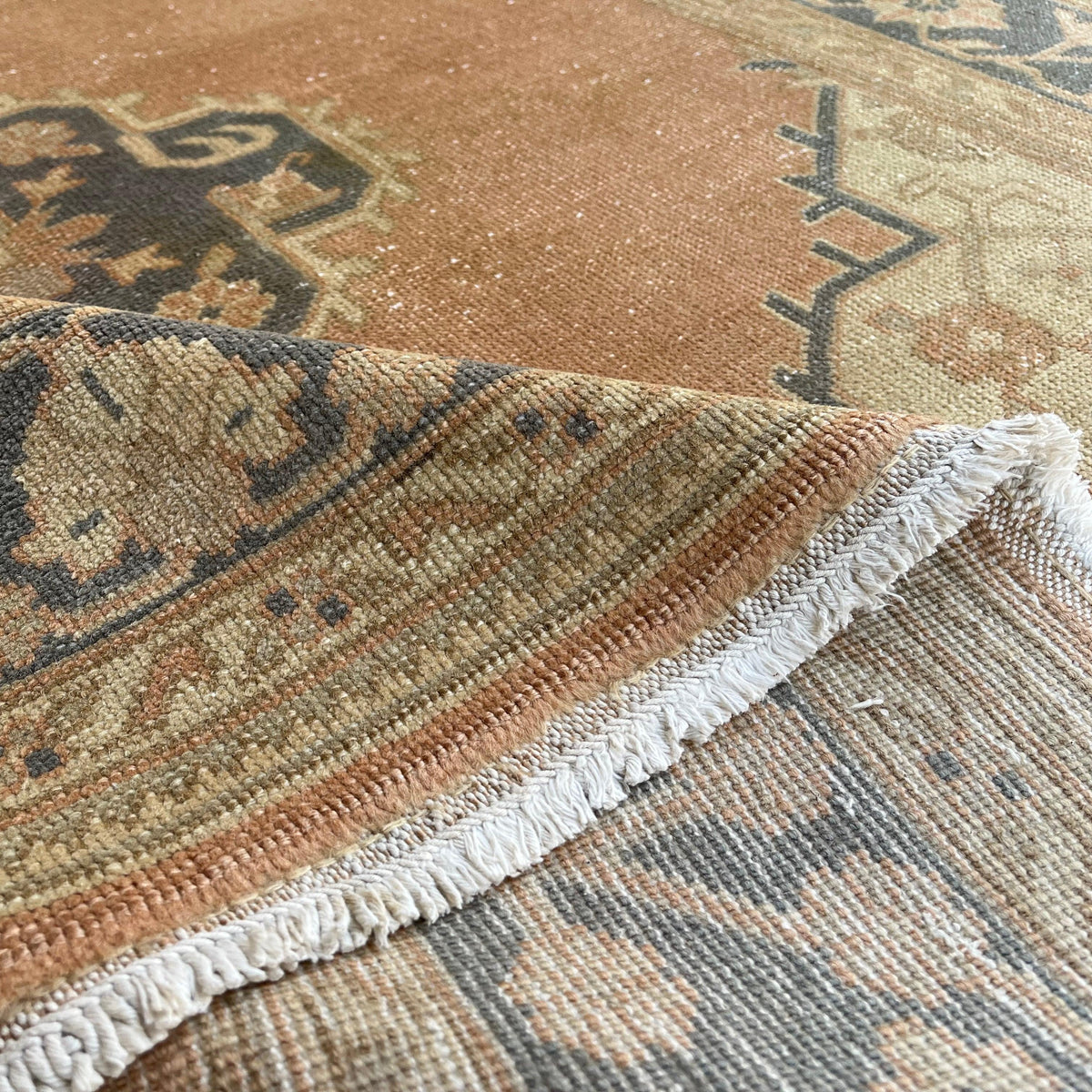 1970s orange vintage turkish runner rug with traditional design, hand-knotted weave and low pile.