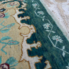 Close-up of the pale green vintage Turkish wool carpet showing traditional details, hand-knotted weave, wool and cotton and low pile.