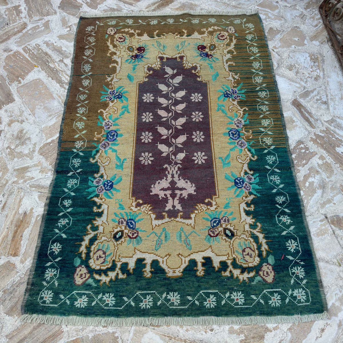 Pale Green 4' x 6' vintage Turkish wool carpet in wool and cotton, shown on the floor.