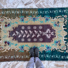 1970s pale green vintage Turkish wool carpet with traditional design, hand-knotted weave and low pile.