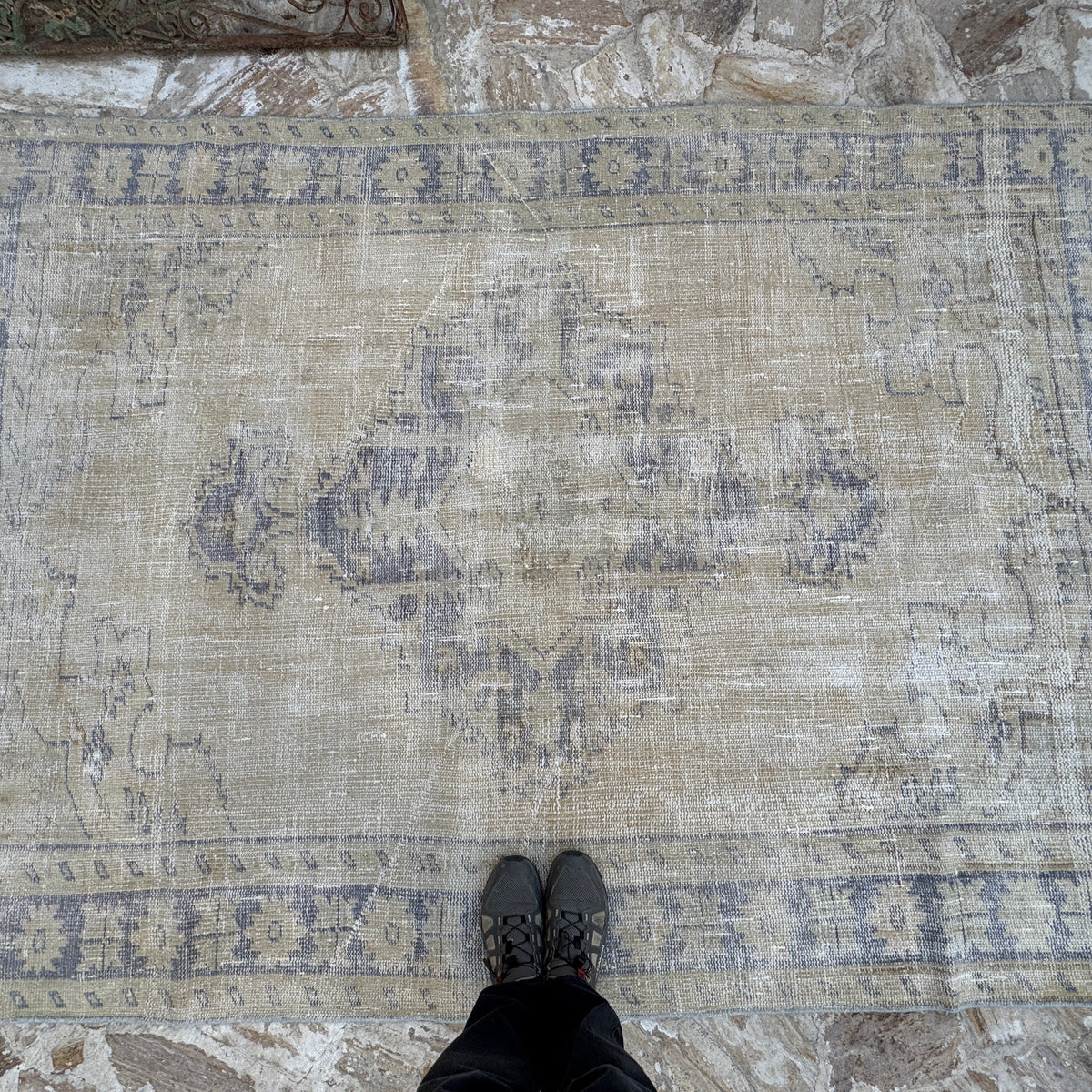 Blue 6' x 8' vintage Turkish wool distressed rug in wool and cotton, shown on the floor.