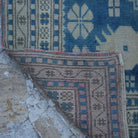 1970s blue vintage Turkish wool rug with neutral design, hand-knotted weave and low pile.