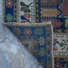 1970s blue vintage Turkish wool rug with traditional design, hand-knotted weave and low pile.