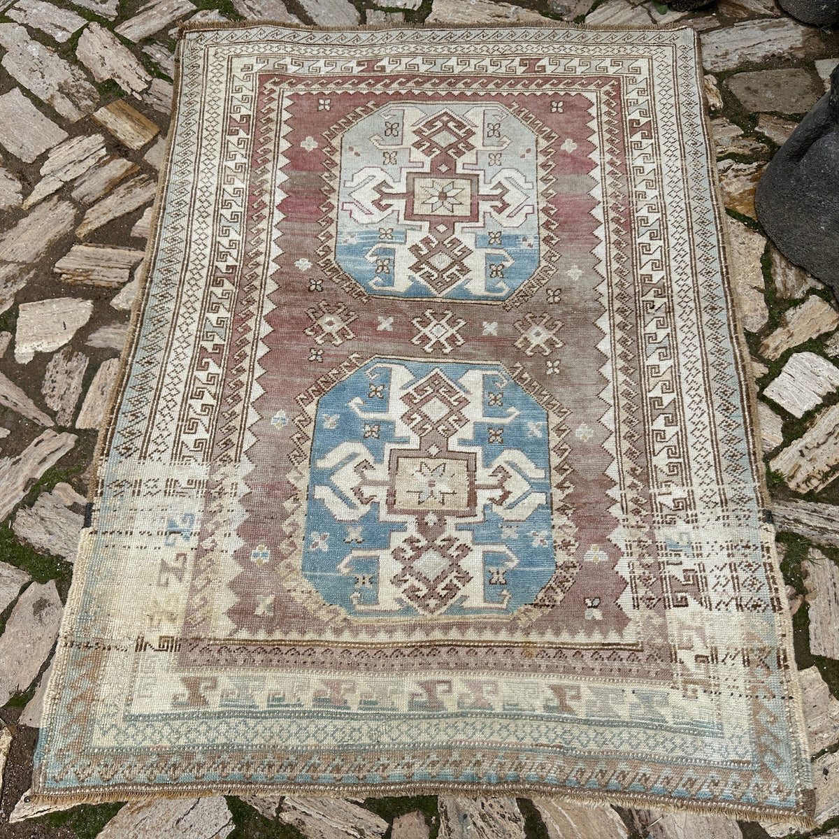 Pale Red 4' x 6' vintage Turkish wool rug in wool and cotton, shown on the floor.