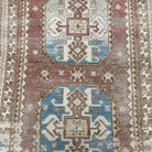 1970s pale red vintage Turkish wool rug with traditional design, hand-knotted weave and low pile.