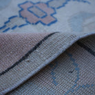Additional view of the pink vintage Turkish wool rug, hand-knotted in wool.