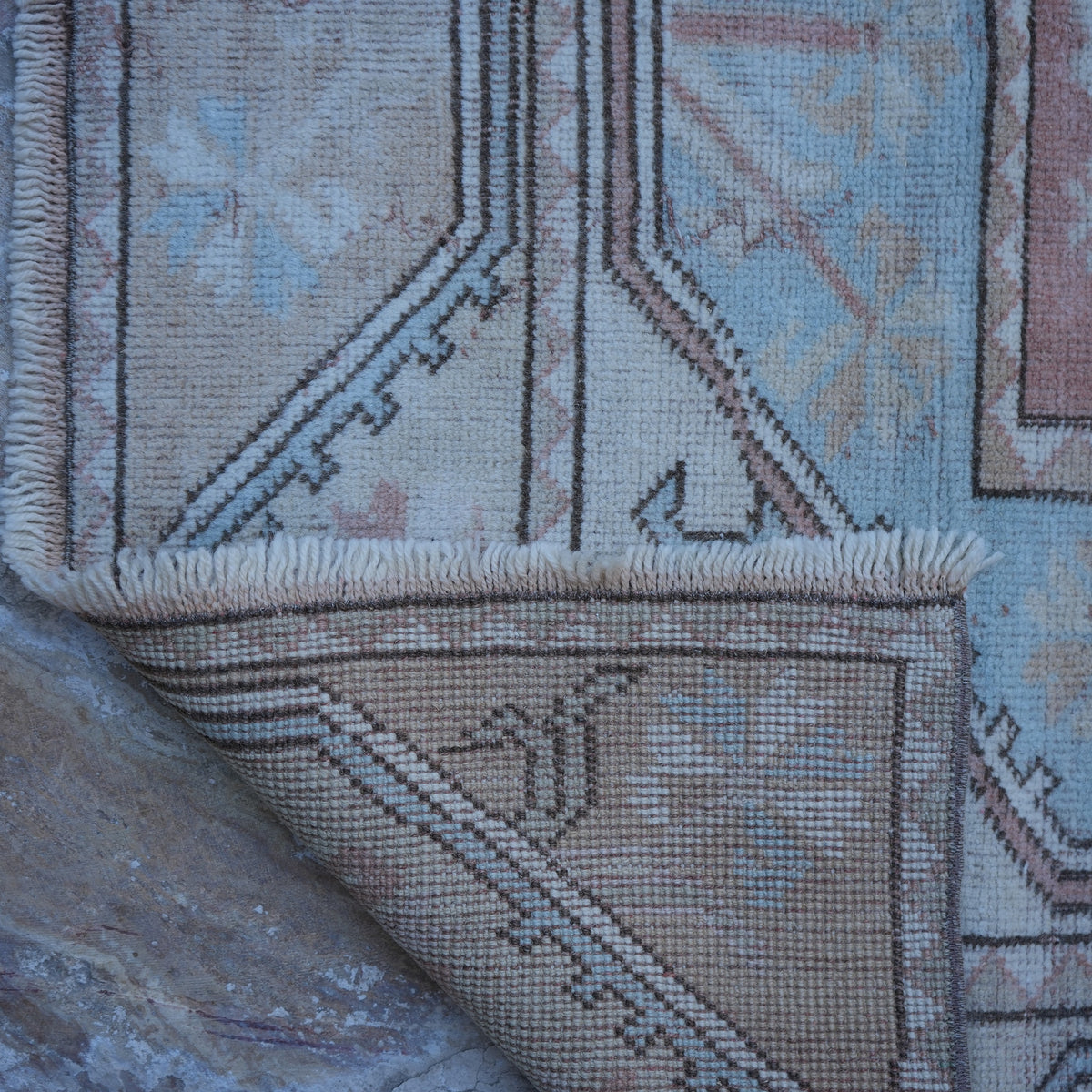 1970s beige vintage Turkish wool rug with traditional design, hand-knotted weave and low pile.